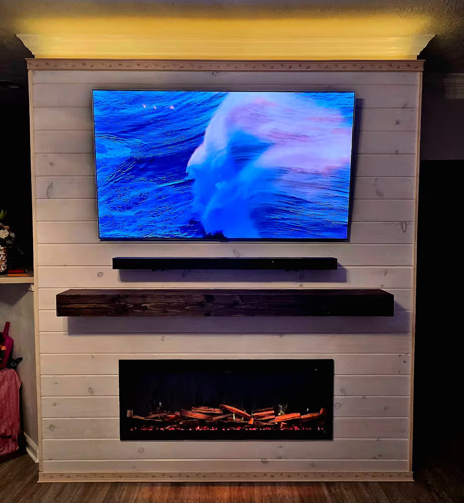 Living room setup with a TV displaying a nature scene above an electric fireplace.