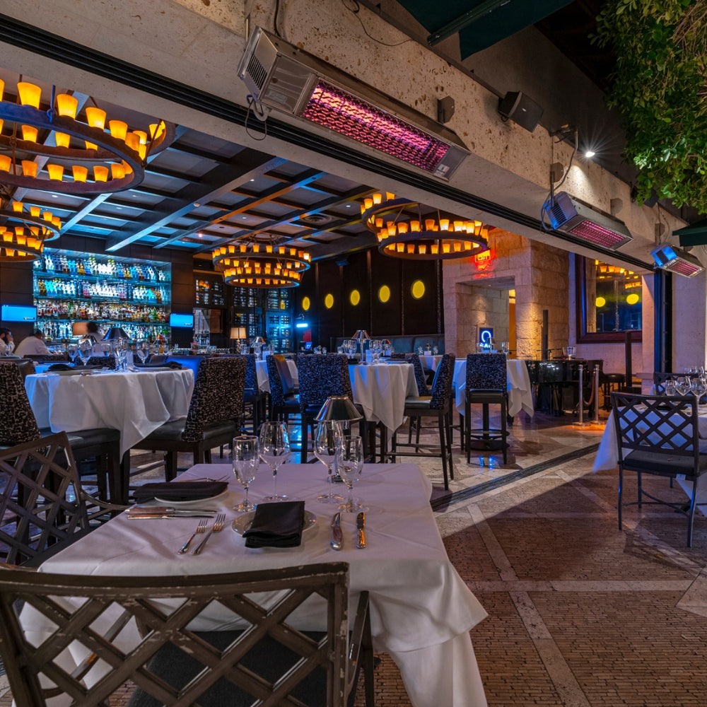 Sunpak S34 Stainless Steel Infrared Gas Heaters with new front grill wall mounted on a patio