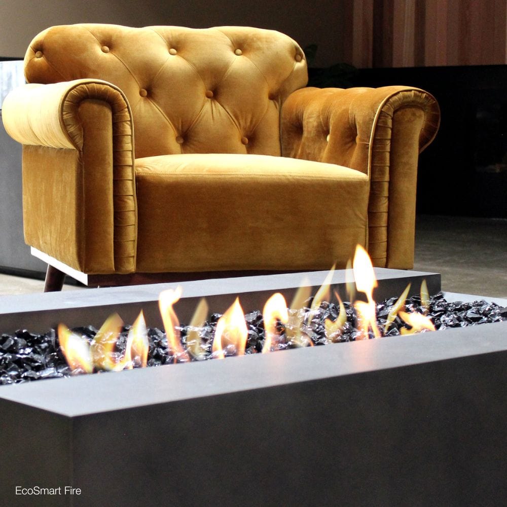 EcoSmart Fire Cosmo 50-Inch Rectangular Fire Pit Table beside a couch