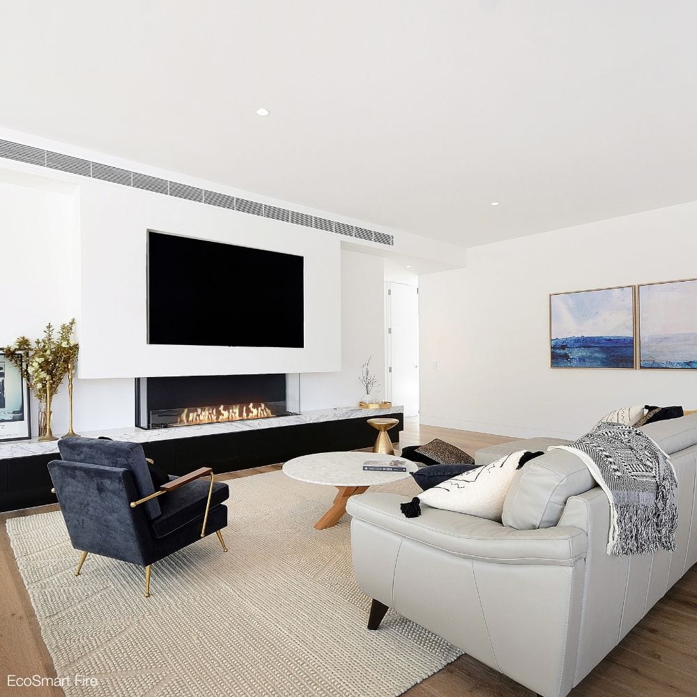 EcoSmart Fire Flex Bay 3-Sided Ethanol Firebox installed below the tv