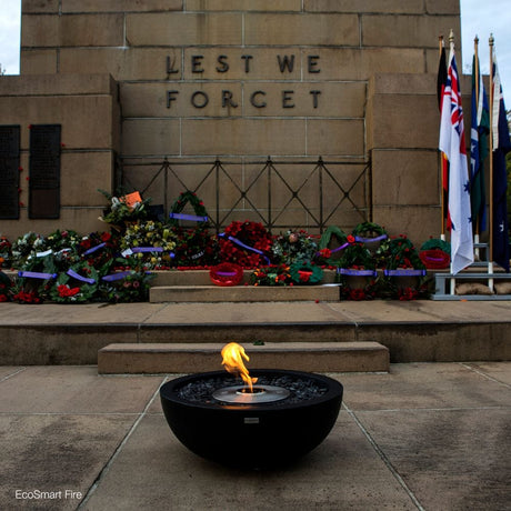 EcoSmart Fire Mix Round Concrete Ethanol Fire Bowl in a memorial