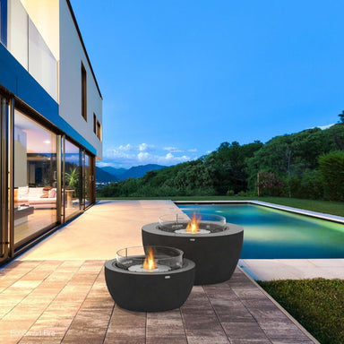 ecosmart fire pod fire bowls beside the swimming pool