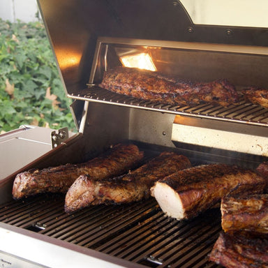 grilling meat on the Fire Magic Echelon Built-In Gas Grill