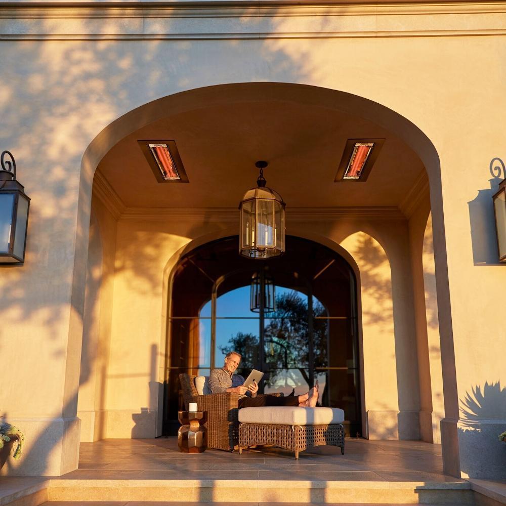 Infratech CD Series 61" 6000W Dual Element Infrared Electric Heater with man reading