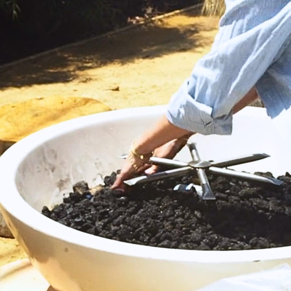 white modern blaze gas fire bowl with lava rocks