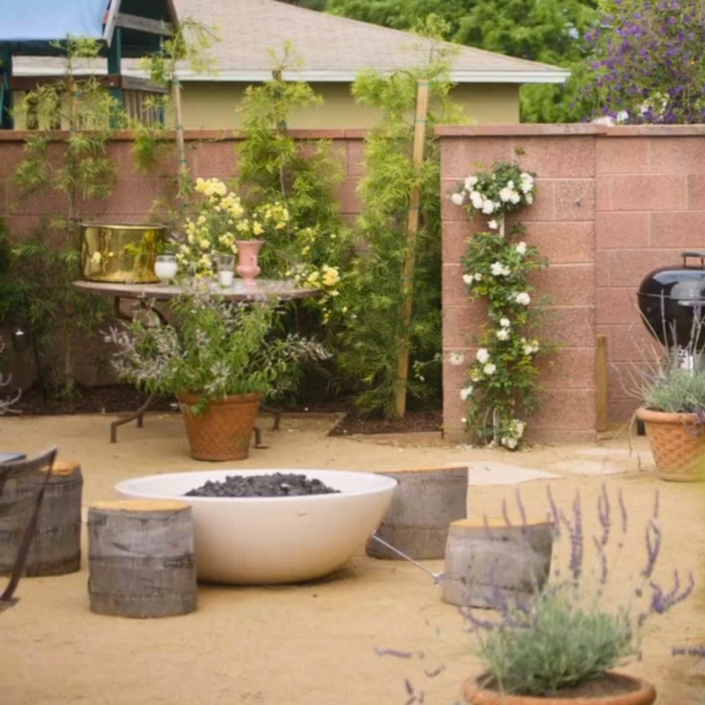 white modern blaze gas fire bowl in a garden