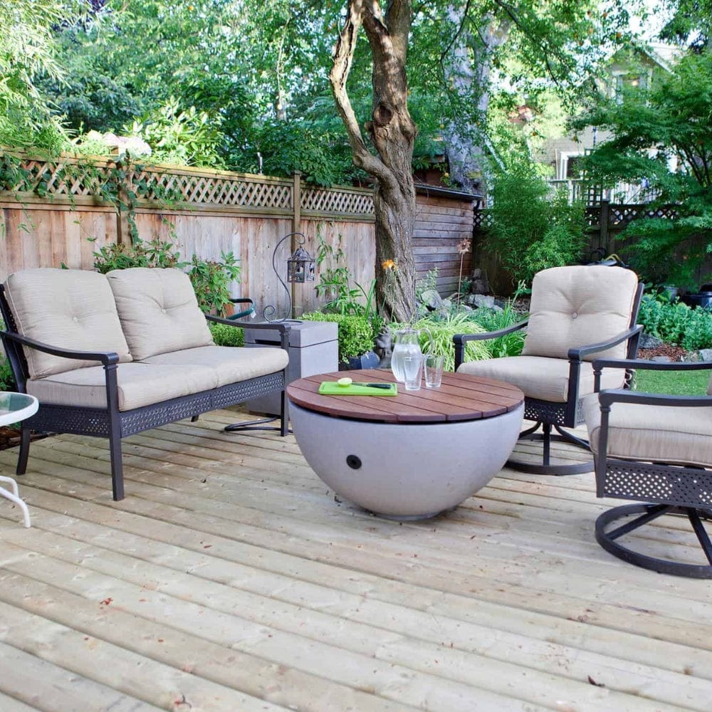 solus round hardwood tabletop on a hemi fire pit