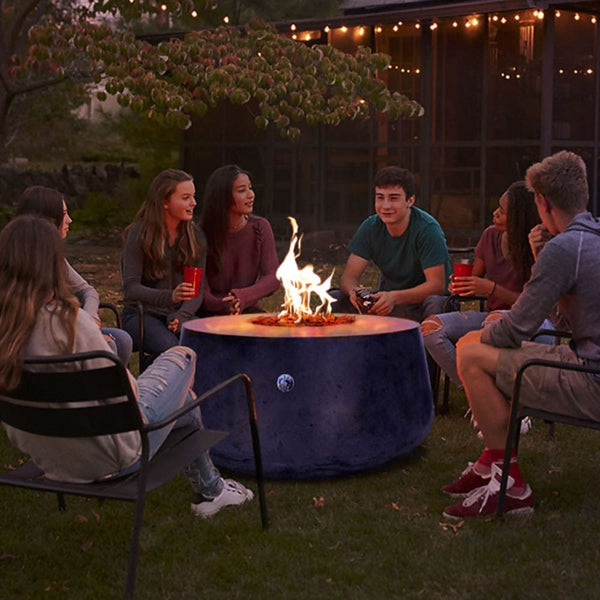 Gathering friends around the Stonelum Indiana 01 47-Inch Round Graphite Gas Fire Pit