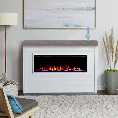 Touchstone Sideline Elite 60 Electric Fireplace with brown faux wood mantel on shiplap wall