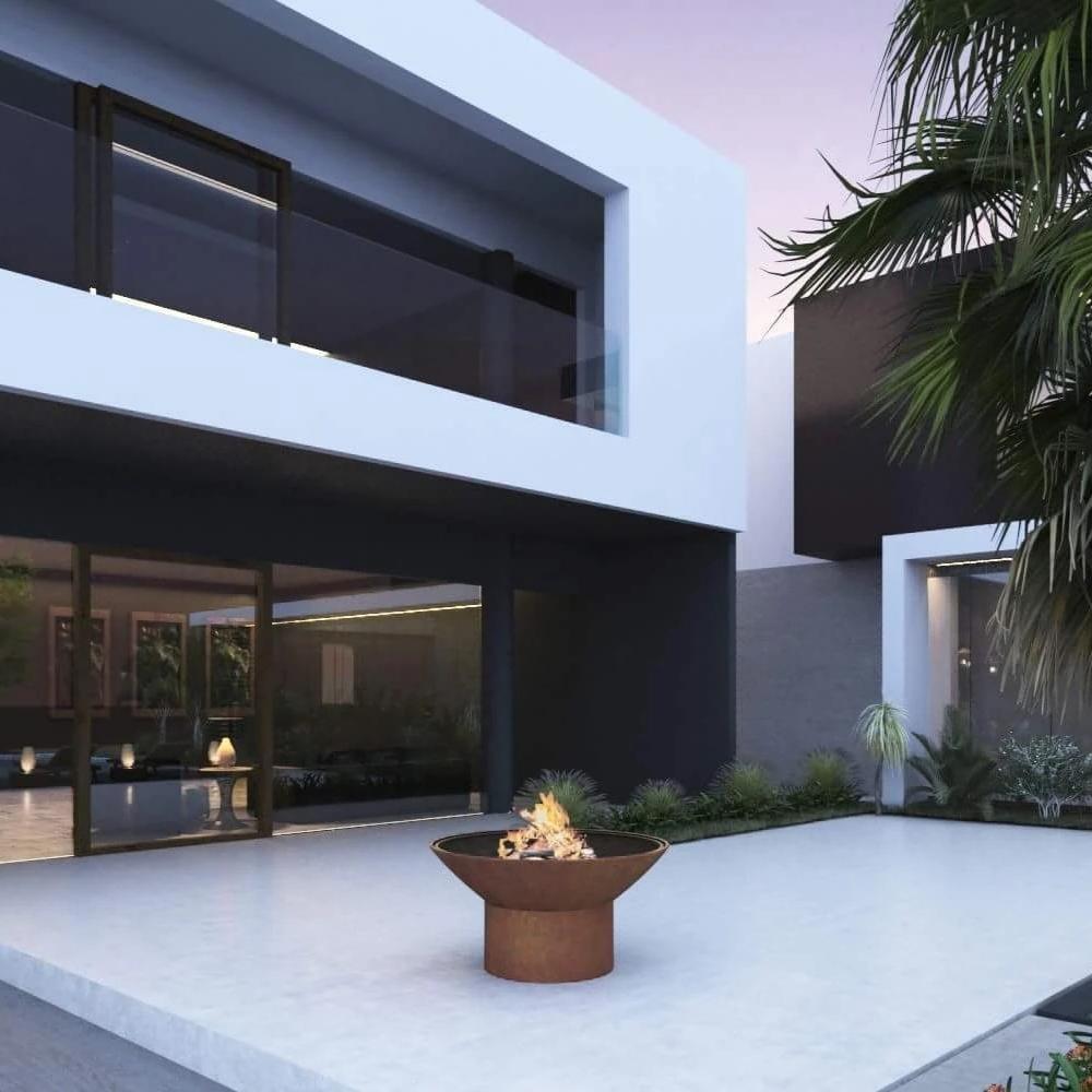 Arteflame 18-Inch Tall Low Round Base Corten Steel Fire Pit in Outdoor Area