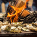 Grilling Oysters on the Arteflame Classic Corten Steel Fire Pit with Storage & Cooktop