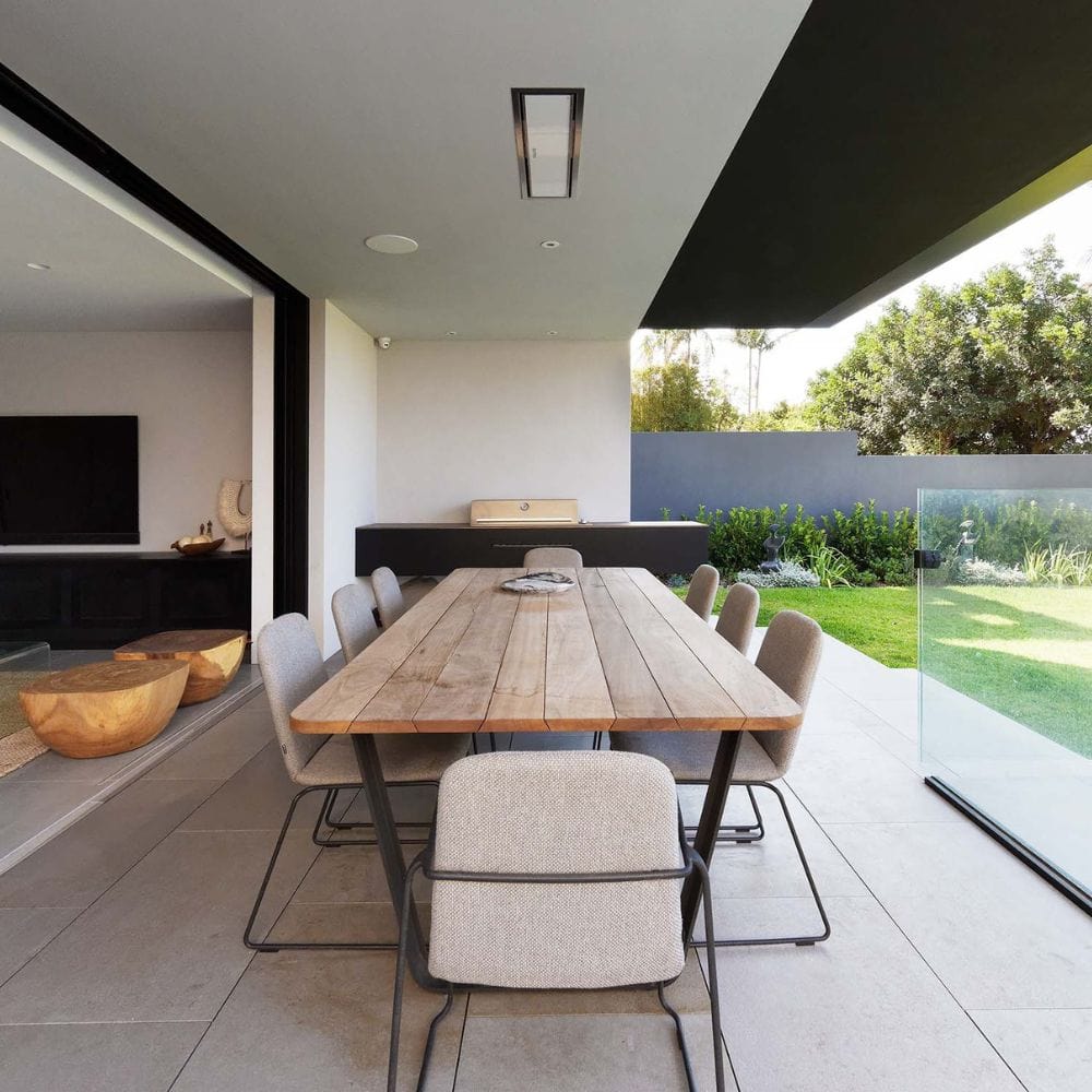 White Bromic Platinum Smart-Heat Electric Heater recessed in the ceiling of a patio