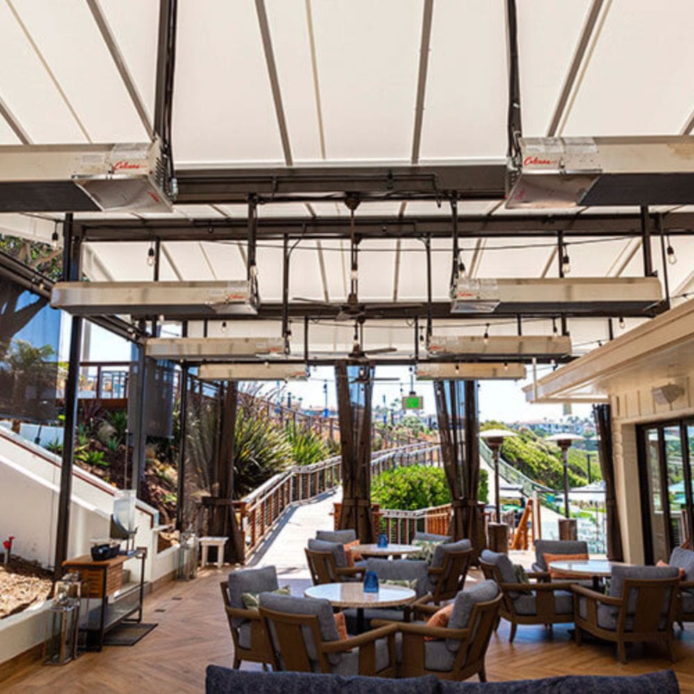 Several Calcana High Output Stainless Steel Gas Patio Heaters in a patio