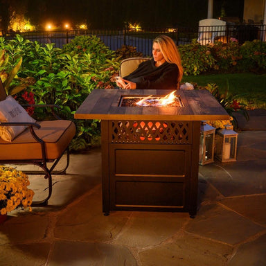 Endless Summer Harris 38" DualHeat Fire Pit Table In a Patio During The Evening
