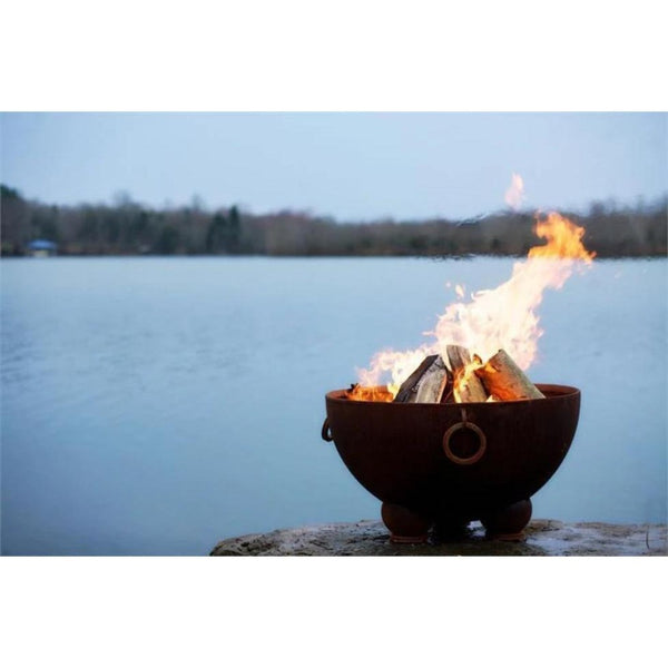 Wood Burning Fire Pit - Fire Pit Art Nepal - 41" Steel Fire Pit (NP) Lit Up Beside A Lake
