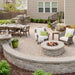 firegear round fire pit kit used in customized white brick gas fire pit in backyard