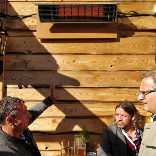 Heatscope Spot 35" Black Electric Heater with People Outdoors