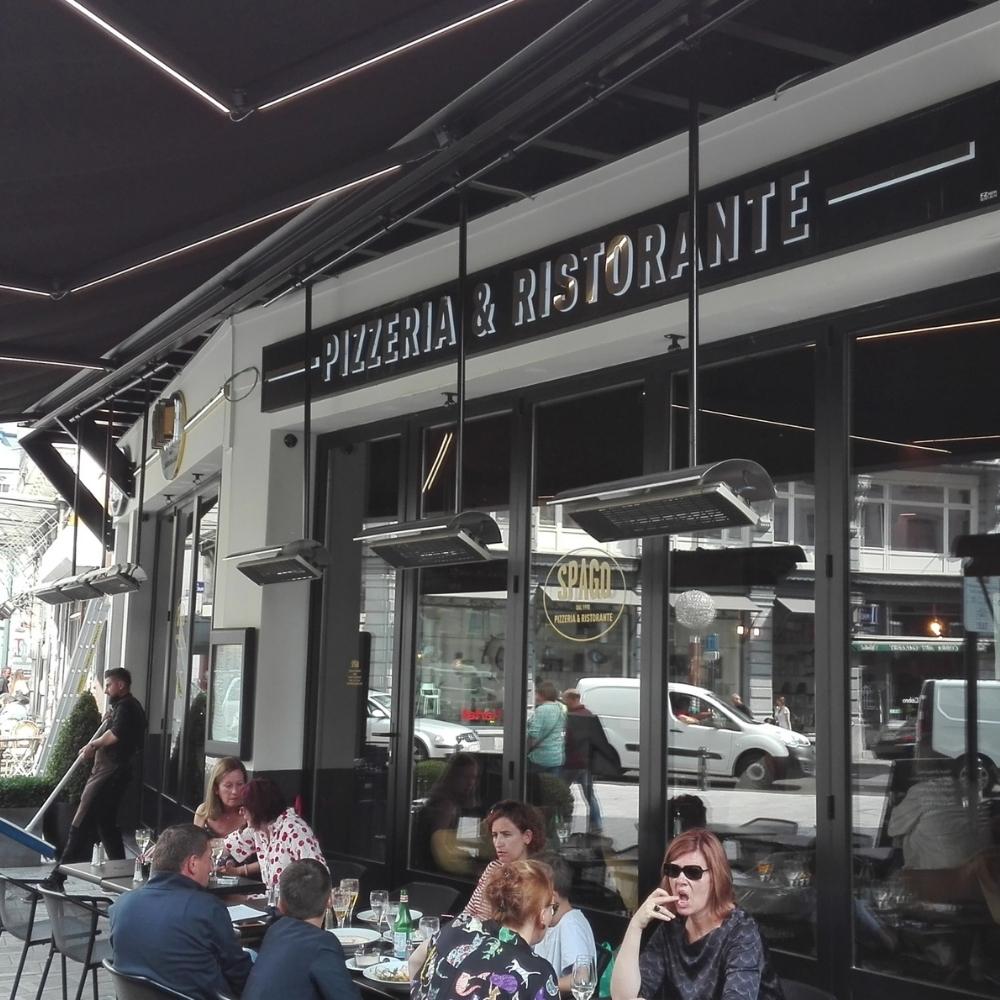 Heatscope Spot 35" Black Electric Heaters in Restaurant Outdoor Dining Area