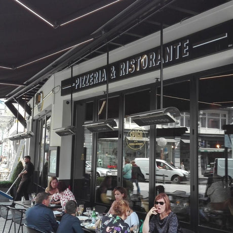 Heatscope Spot 35" Black Electric Heaters in Restaurant Outdoor Dining Area