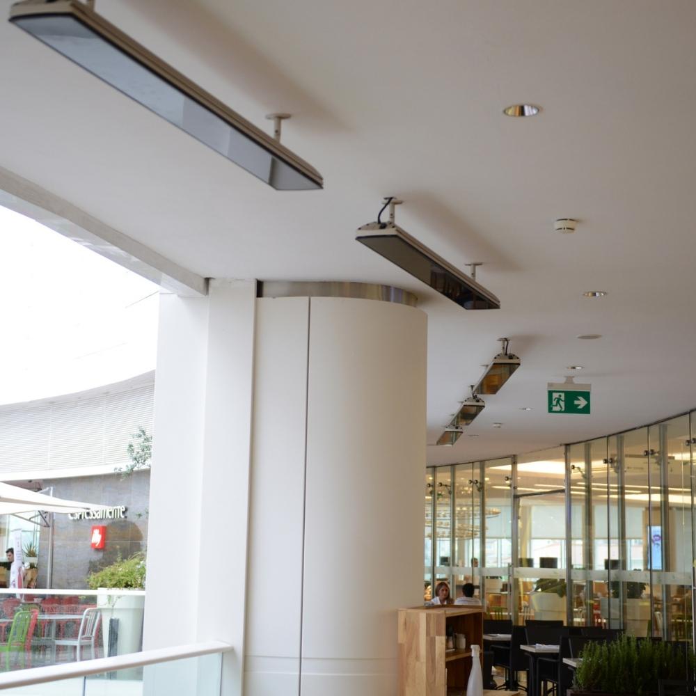 Heatscope Vision 65" Black Electric Heaters in Restaurant Dining Area