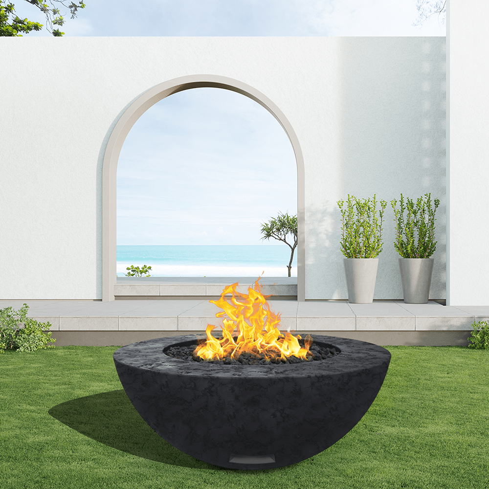 modern blaze round raven fire bowl with textured surface in a light outdoor setting
