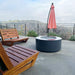 Modern Blaze Oblica Gray Round Concrete Fire Pit Table with scenic view