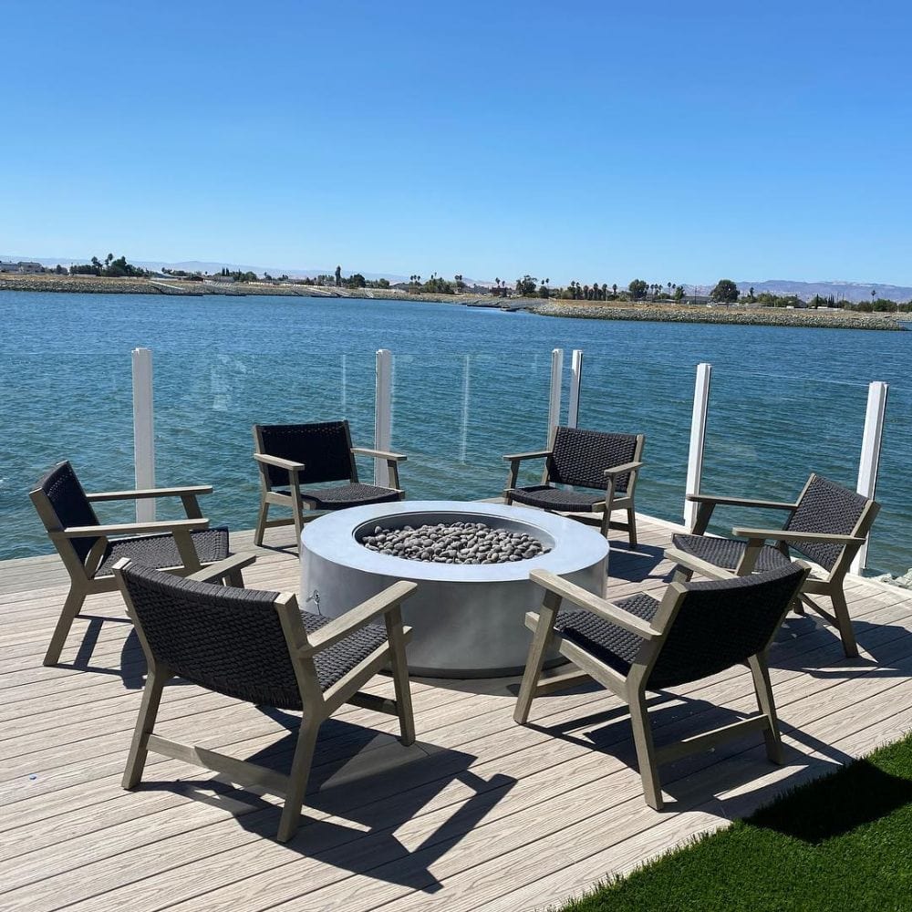 Modern Blaze Oblica Gray Round Concrete Fire Pit Table by the lake