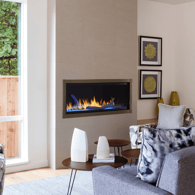 Monessen Artisan 48" Vent Free Gas Fireplace with blue LED lights and driftwood logs