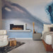 napoleon stylus cara elite electric fireplace in a bedroom on a blue washed out wall