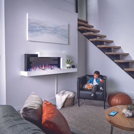 a kid relaxing by the napoleon stylus cara elite wall mounted electric fireplace