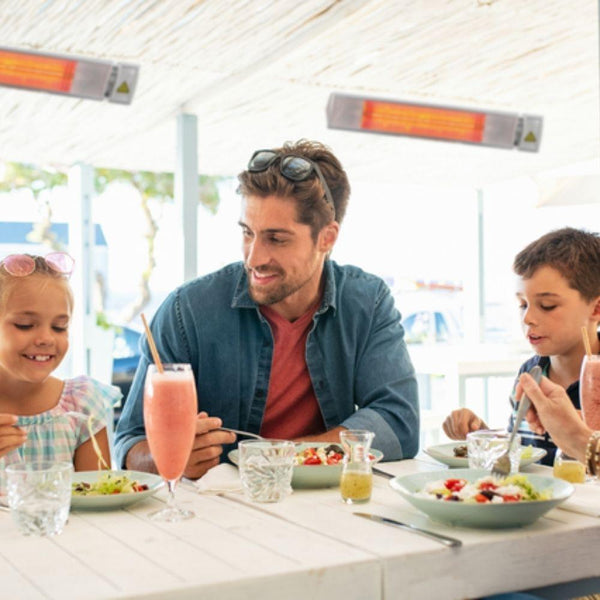 NEL 26" 1500W 120V Indoor/Outdoor Infrared Electric Heater in Restaurant setting