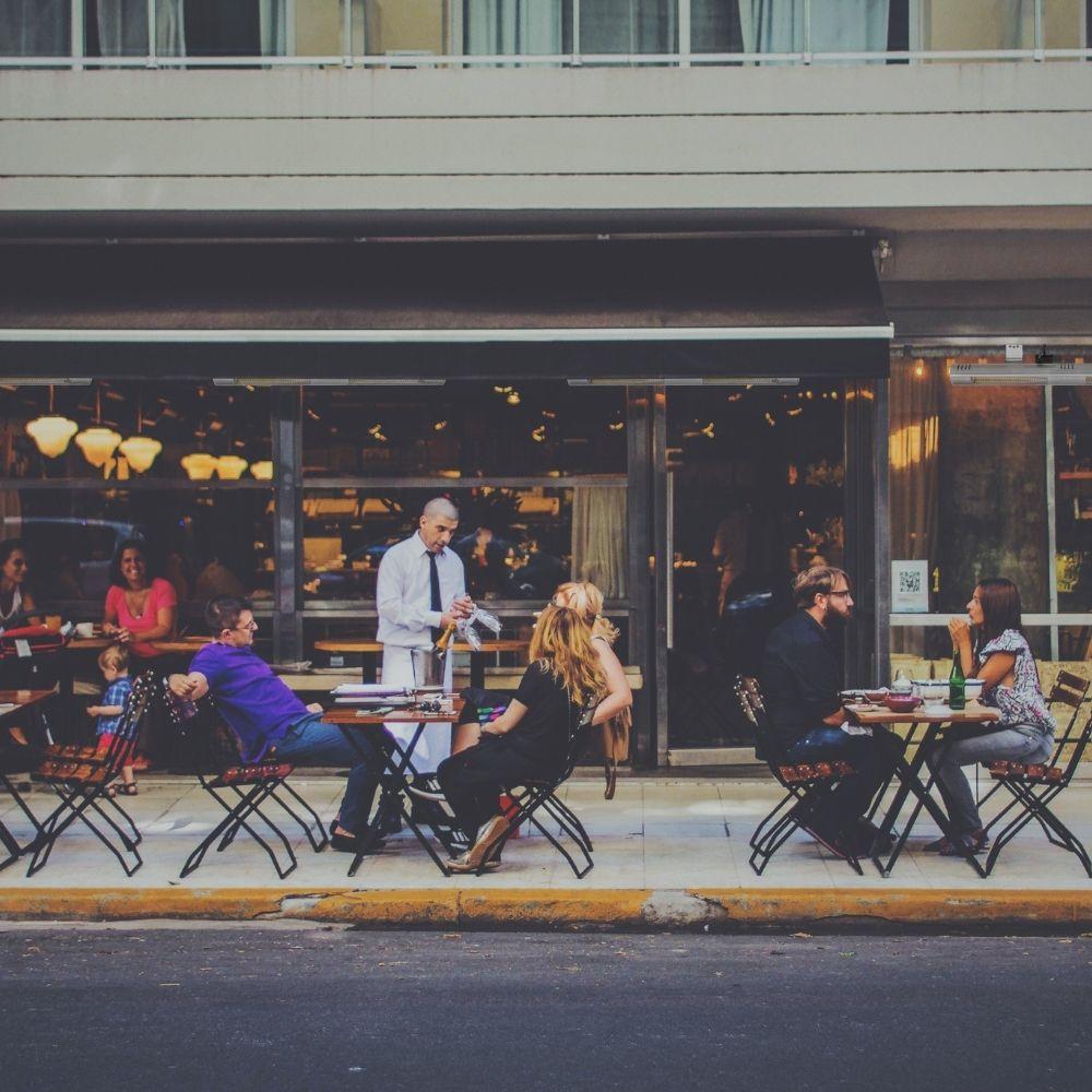 NDUSTRIA NEL 37" 3000W 240V Electric Patio Heater at an outdoor cafe