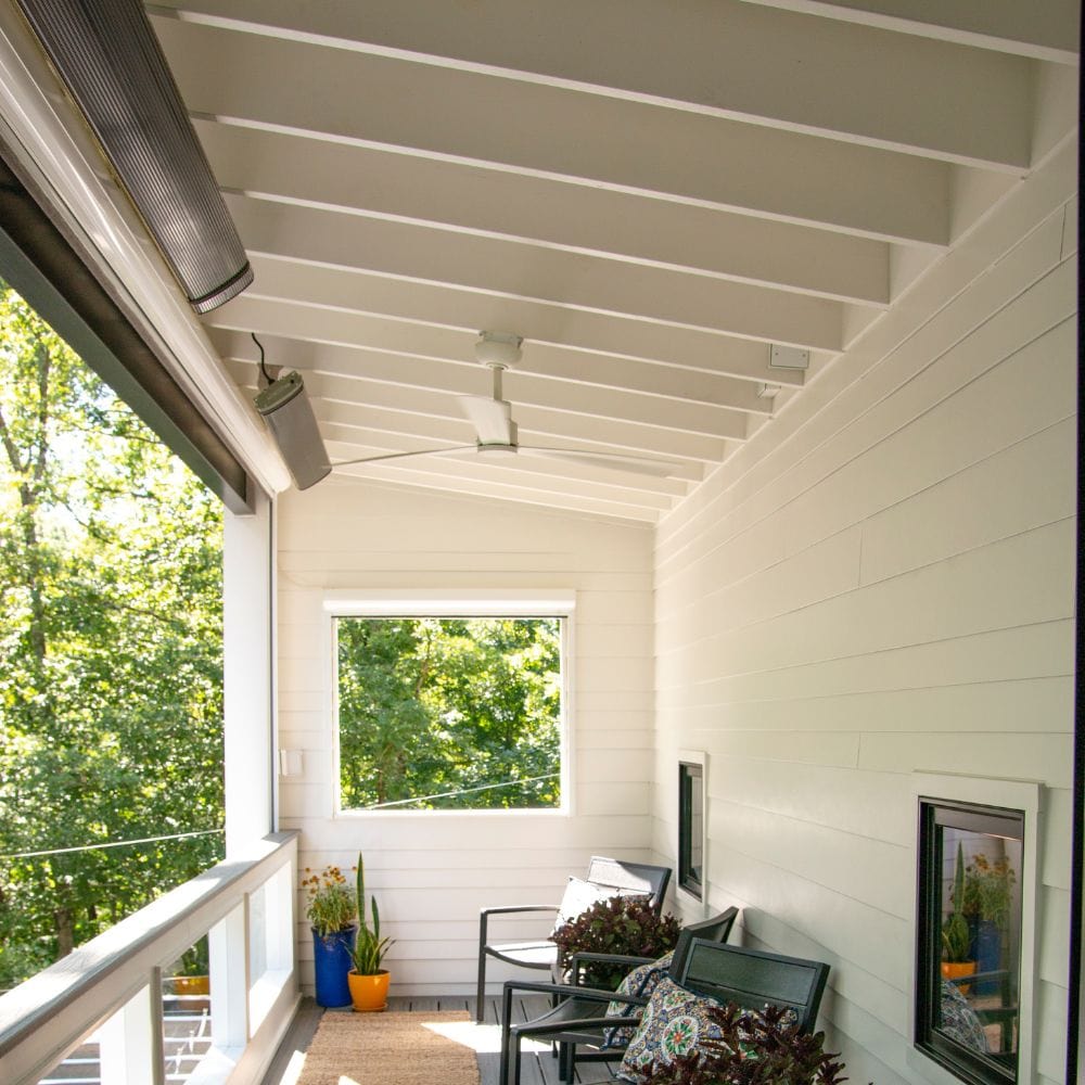 2 radtec design/e series infrared electric heaters ceiling mounted on a terrace