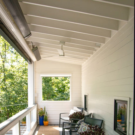 2 radtec design/e series infrared electric heaters ceiling mounted on a terrace