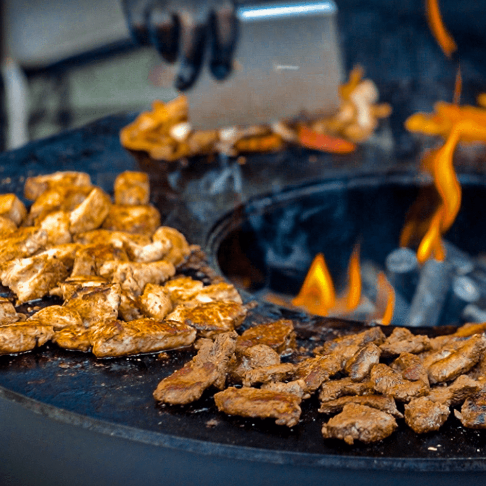 grilling meat on seasons fire pits fire pit grill