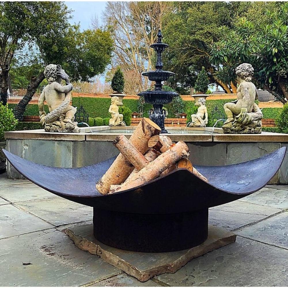 Seasons Fire Pits Quadrilateral Square Steel Fire Pit by a Fountain