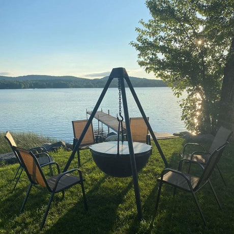 black fire pit grill by cowboy cauldron at the backyard