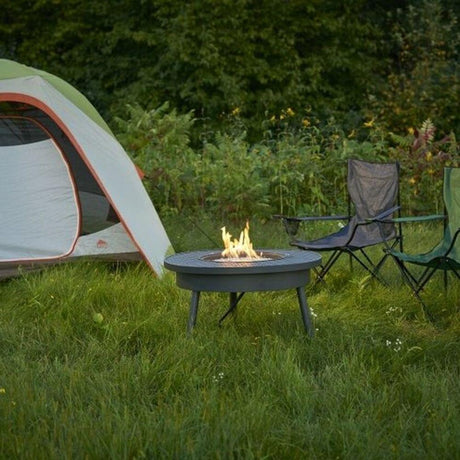Renegade 32-Inch Round Portable Gas Fire Pit Table (RNG-32) outside tent