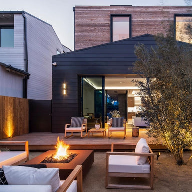a cozy backyard setting with the cabo corten steel gas fire pit