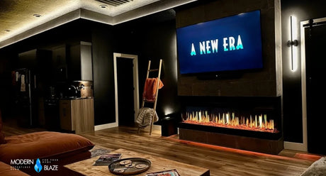 Long linear electric fireplace below a television in a dark media room