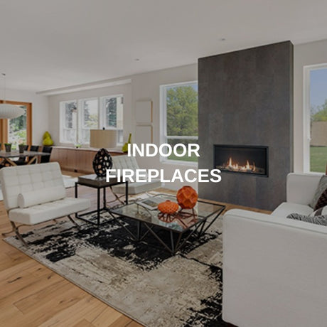 Linear gas fireplace set into a slate wall in a bright contemporary living room