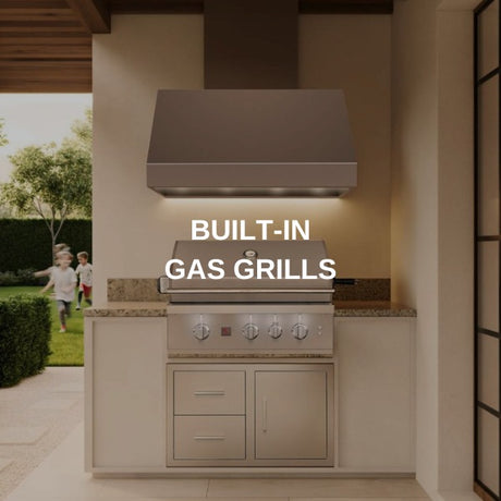 Stainless built-in gas grill set into a finished outdoor kitchen island under a vent hood