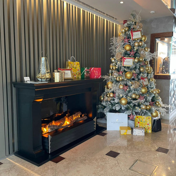 GlammFire York Water Vapor Fireplace with Mantel besides Christmas Tree