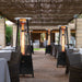 Paragon Outdoor Inferno Flame Tower Patio Heaters in black at a restaurant