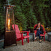 Paragon Outdoor Inferno Flame Tower Patio Heater with a couple of seats beside it