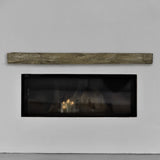 hayloft beam pale honey mantel on a white wall