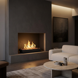 Majestic Contemporary vented gas burner with Copper Embers fire glass burning in a charcoal plaster fireplace in a minimalist living room