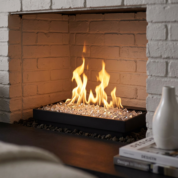 Majestic Contemporary vented gas burner with Crystal Embers fire glass, close-up of flames reflecting in the clear glass in a white brick fireplace
