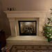 Omega 1110.511 GS Cast Stone Fireplace Mantel Surround beside a christmas tree