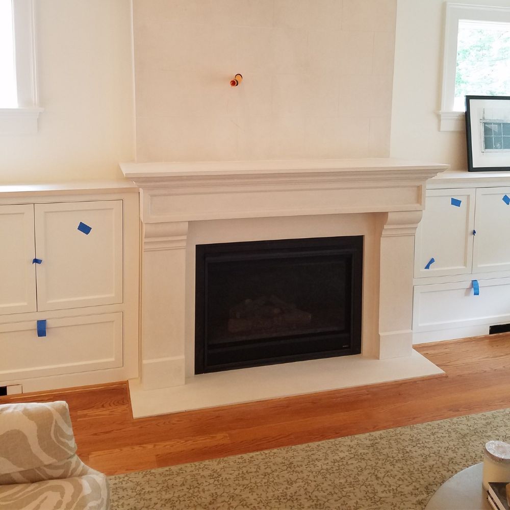 Omega 1111.556 GS 77-Inch Cast Stone Fireplace Mantel Surround in a living room